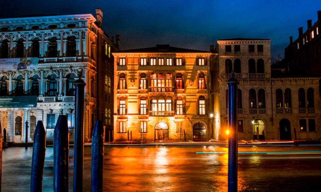 Palazzo Bernardo Nani at night with gondolas