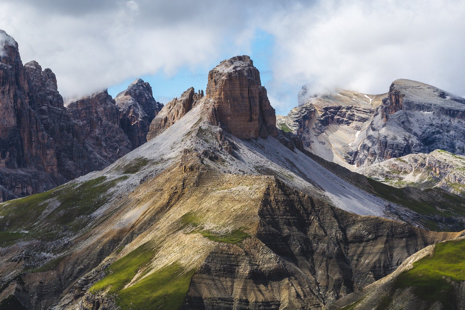 Lateral view of Three Peaks of Laveredo at spring in a cloudy and sunnt day