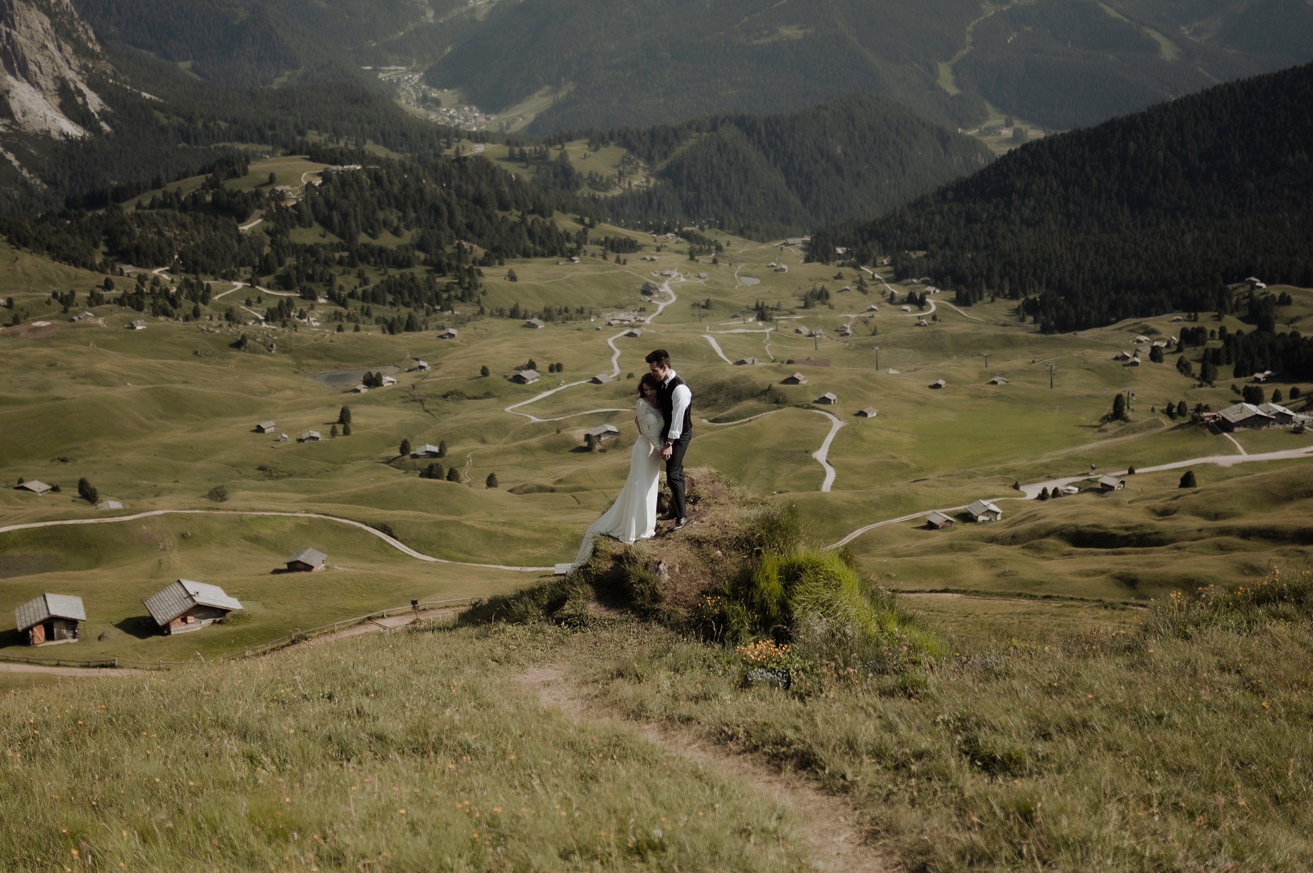 Groom hugging bride at Seceda Dolomites Elopement in Italy