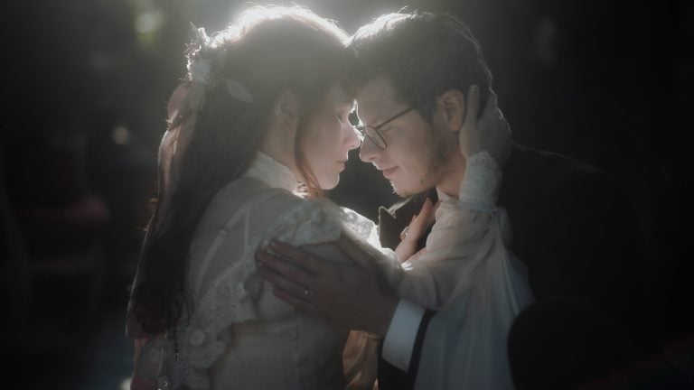 Bride hugging groom at sunset during intimate wedding at chateau de mairy, a french wedding venue near Paris