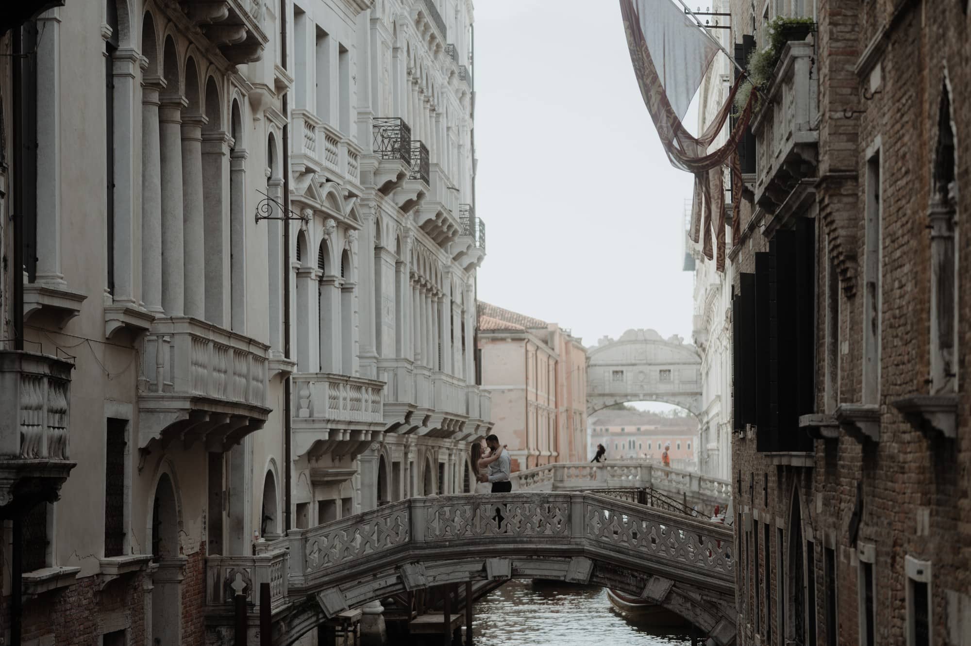 bride and groom on a bride during Venice elopement